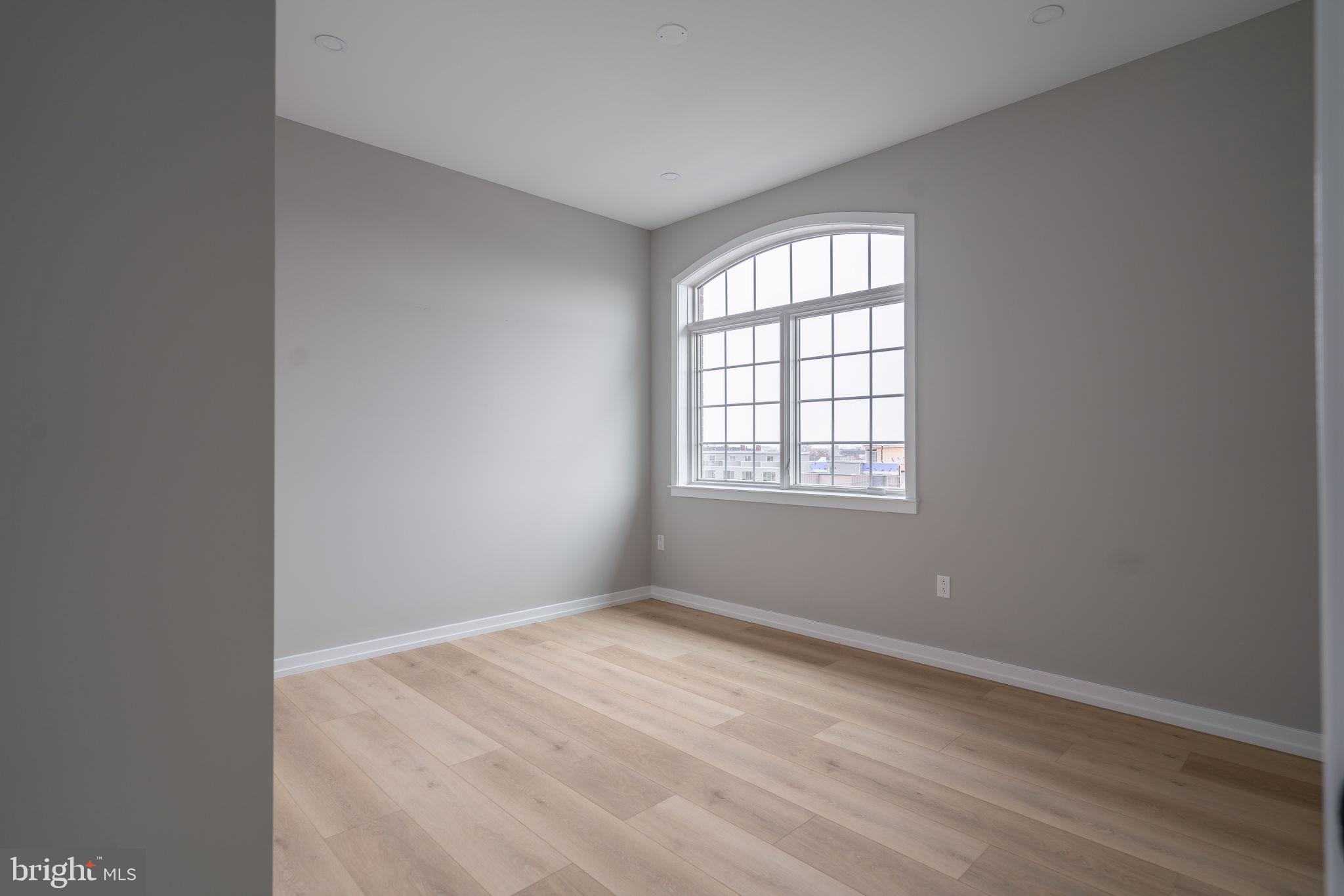 2401 Washington Avenue, Unit 5D Philadelphia, PA 19146 - Photo 14 of 18 an empty room with a window