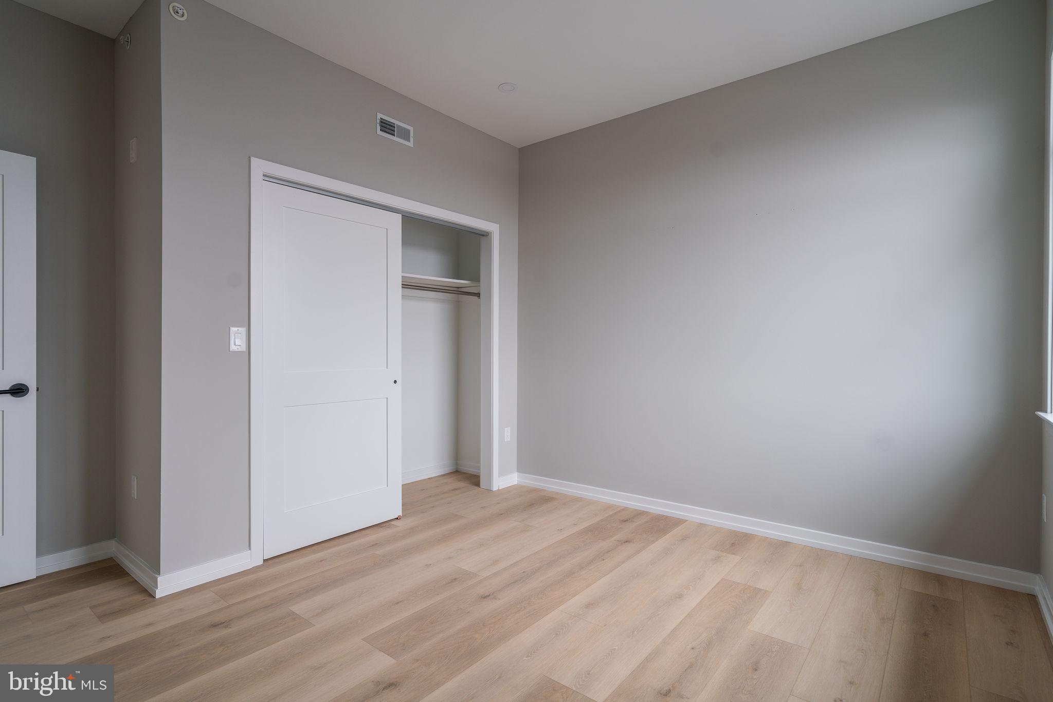 2401 Washington Avenue, Unit 5D Philadelphia, PA 19146 - Photo 15 of 18 a view of empty room with wooden floor