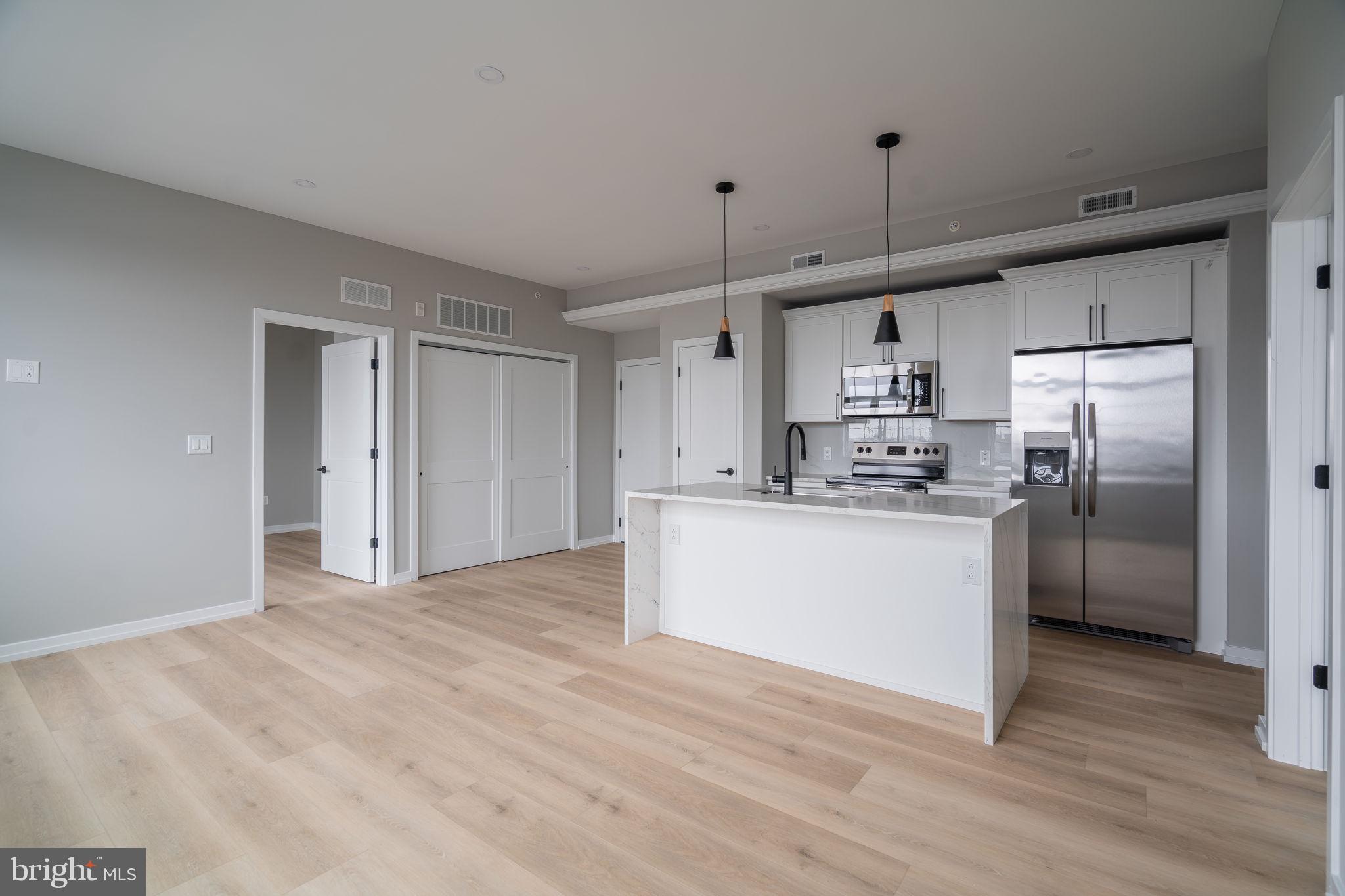 2401 Washington Avenue, Unit 5D Philadelphia, PA 19146 - Photo 4 of 18 a view of kitchen with wooden floor