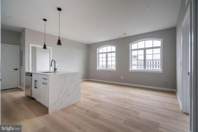 a view of a kitchen with windows