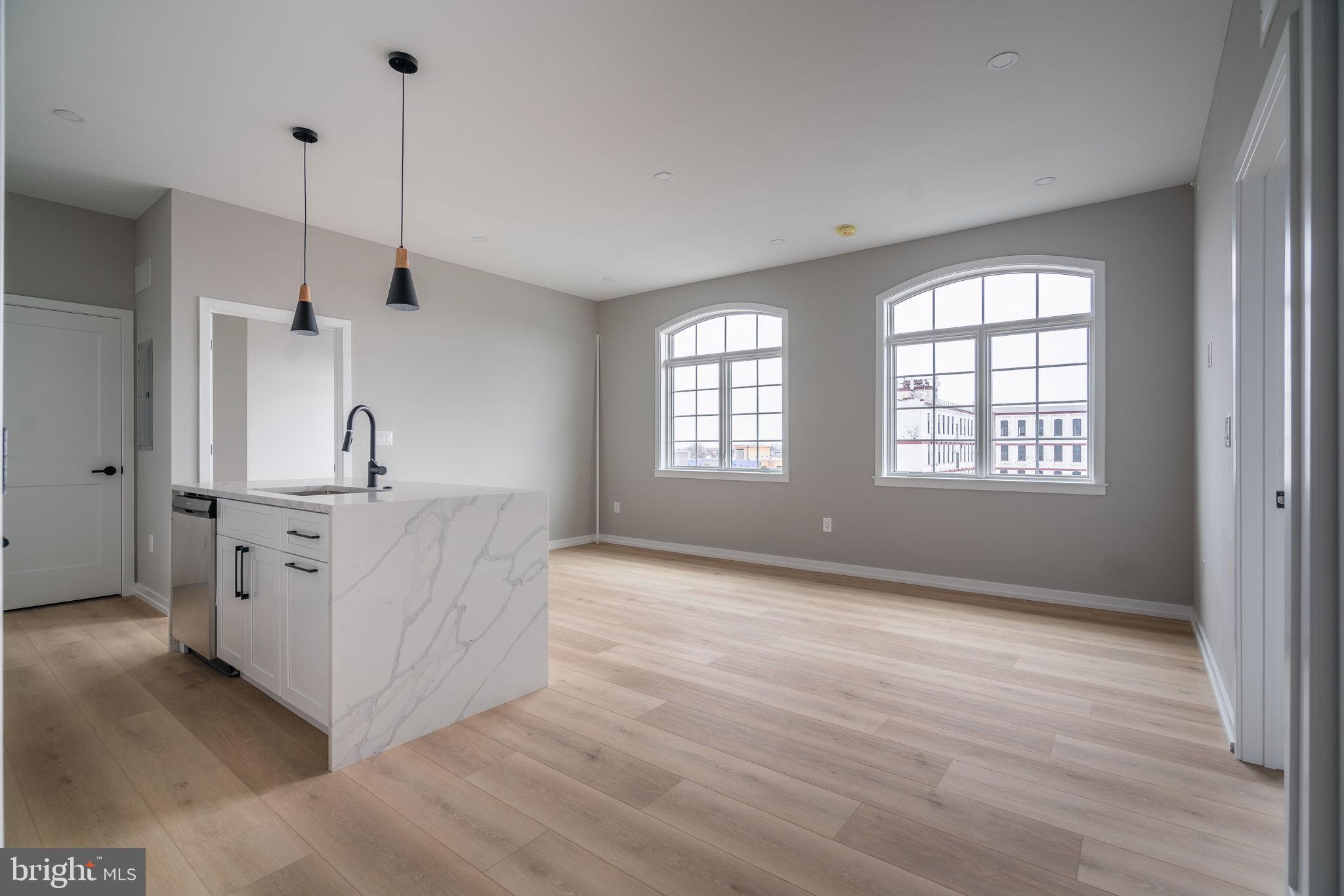 2401 Washington Avenue, Unit 5D Philadelphia, PA 19146 - Photo 7 of 18 a view of a kitchen with windows