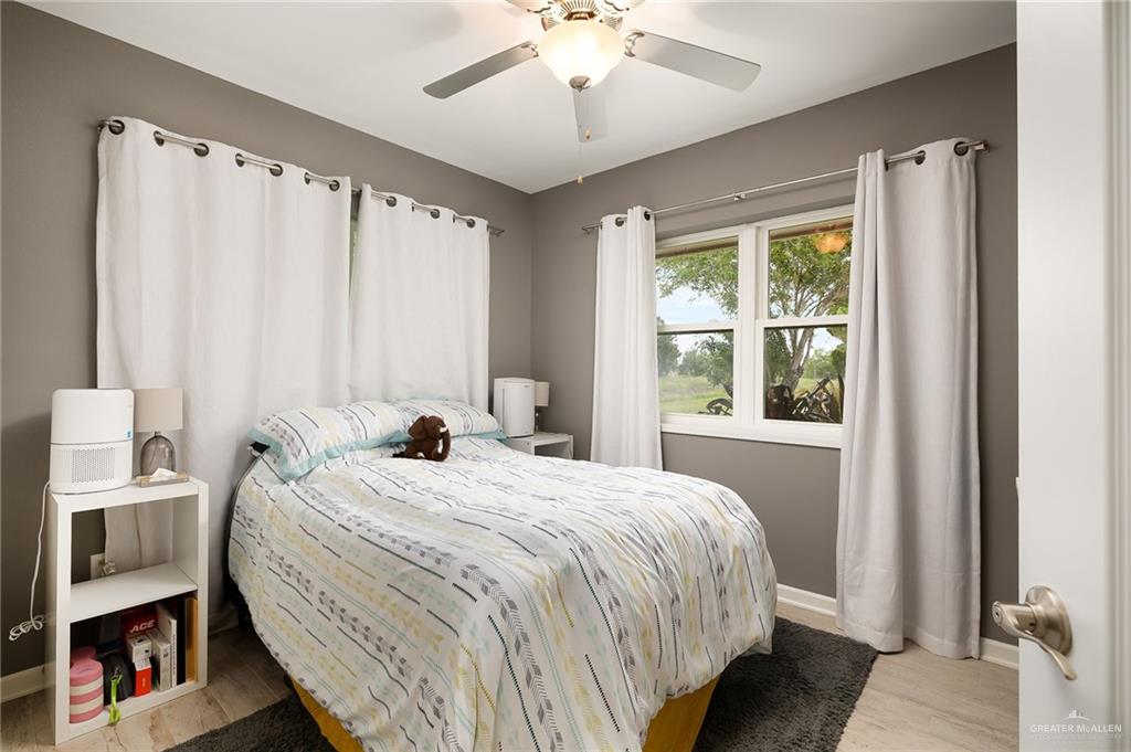 22172 North Olmito Road Rio Hondo, TX 78583 - Photo 20 of 33 a bedroom with a bed and a window