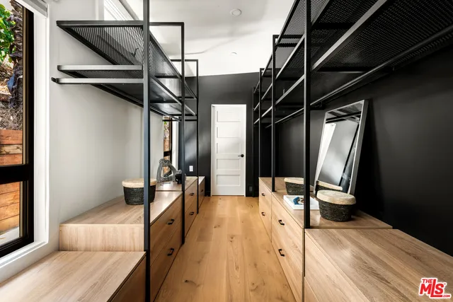 a bathroom with a double vanity sink mirror and shower