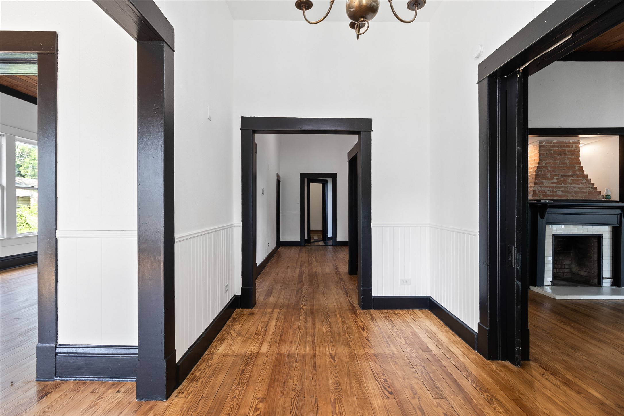 327 South Robb Street Trinity, TX 75862 - Photo 3 of 20 a view of a hallway with wooden floor and staircase