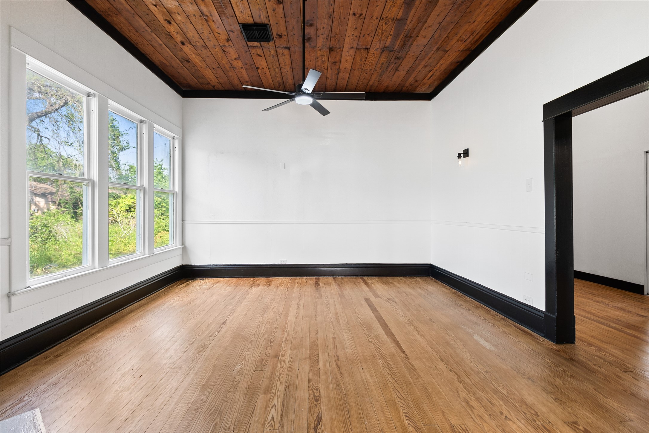 327 South Robb Street Trinity, TX 75862 - Photo 5 of 20 a view of a room with wooden floor and window