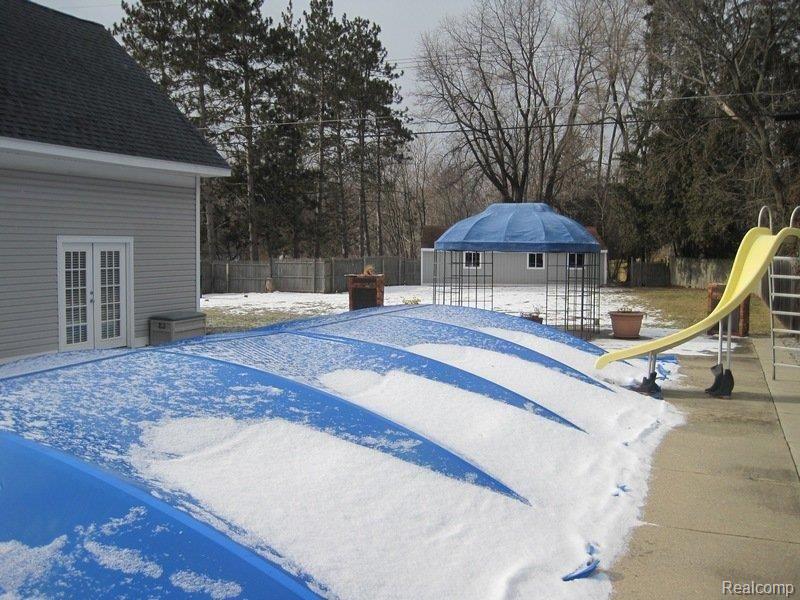 1397 Decker Road Walled Lake, MI 48390 - Photo 22 of 25 Covered inground pool.jpg