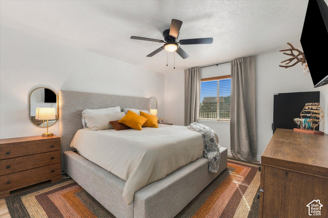 437 Scenic Heights Road Kamas, UT 84036 - Photo 4 of 46 Recessed lighting, ceiling fan with integrated light, upholstered bed frame, window with blinds, and drapery rods