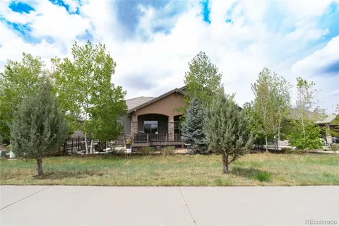 a view of house with outdoor space and garden
