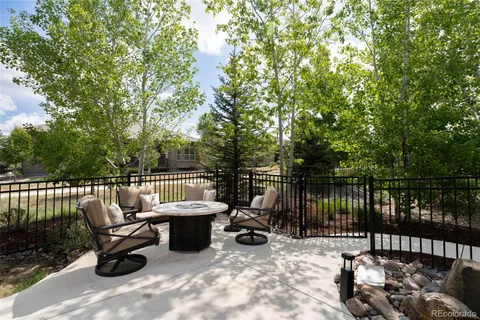 a view of a patio with two chairs and a table