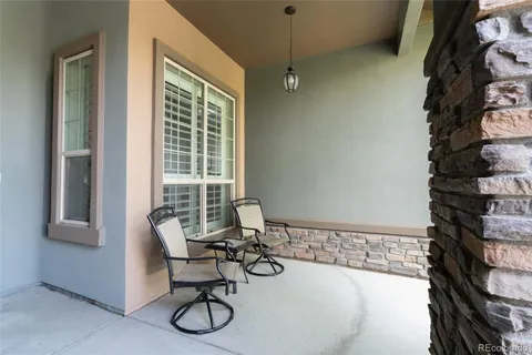 a view of a very nice looking dining room with a table and chairs