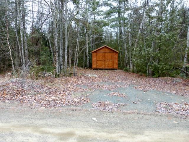 557 Phinney Farm Road Lincoln, ME 04457 - Photo 29 of 32 Driveway with storage.