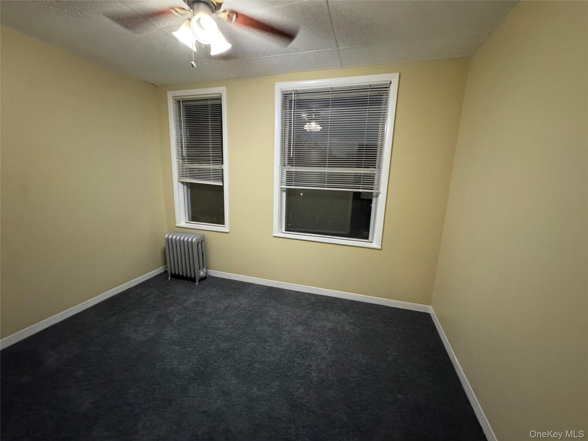 40-13 201st Street Queens, NY 11361 - Photo 15 of 16 an empty room with a window