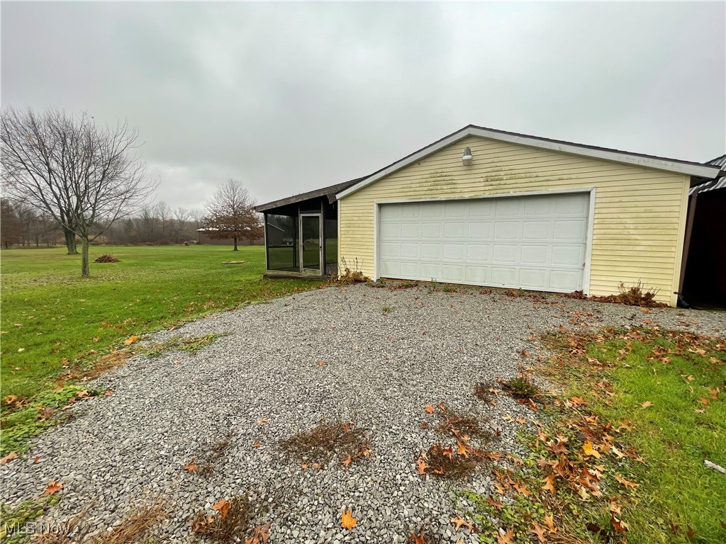 9945 Quarry Road Amherst, OH 44001 - Photo 28 of 30 Garage featuring a yard