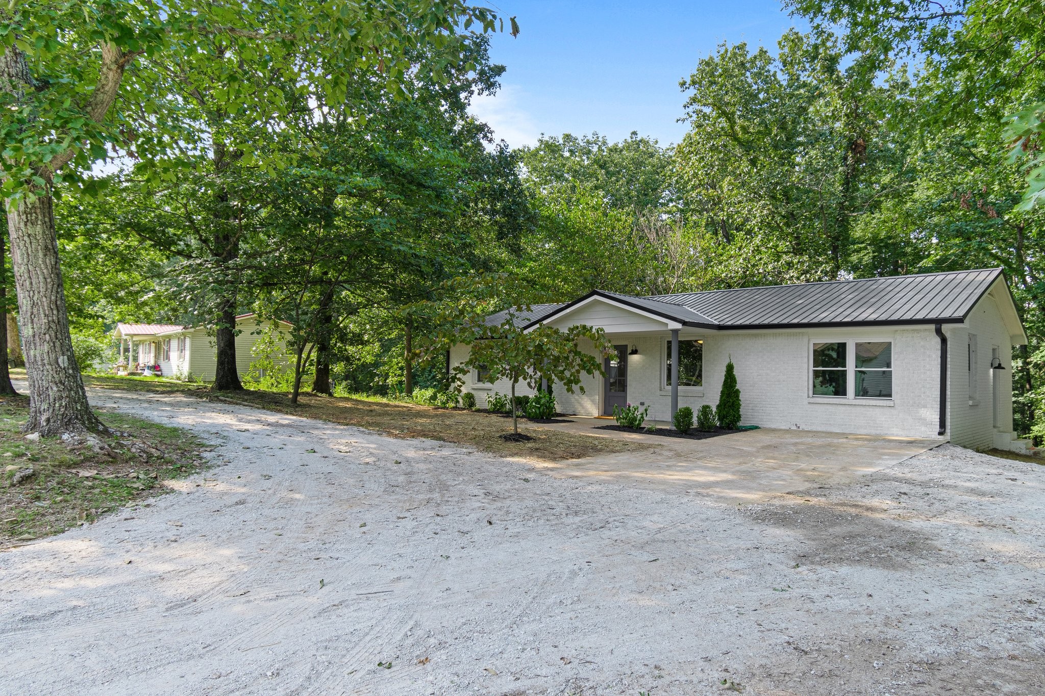 6167 Parker Road Lyles, TN 37098 - Photo 5 of 28 a view of a house with a yard and large tree