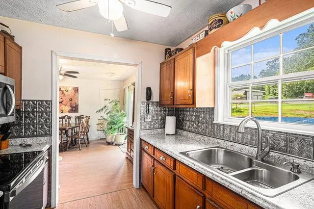 a kitchen with a sink and a refrigerator