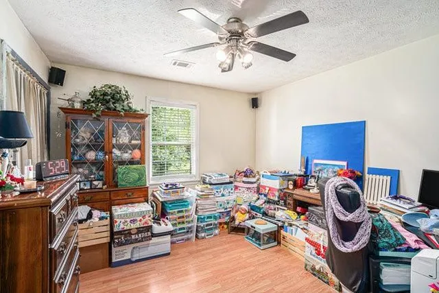 a room with furniture a chandelier and a window