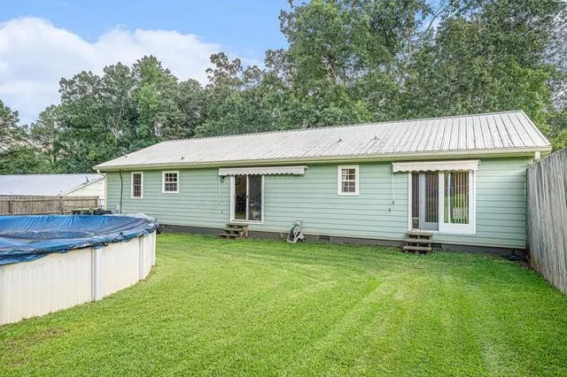 a front view of a house with a garden