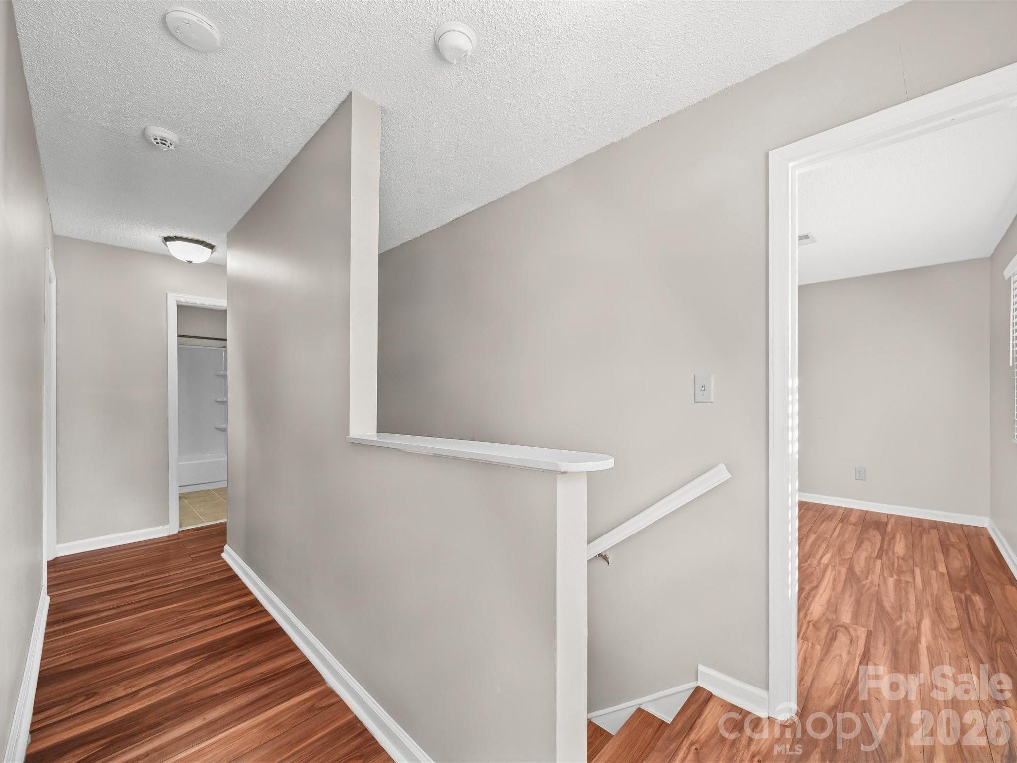 10351 Fink Road Mount Pleasant, NC 28124 - Photo 13 of 20 a view of a hallway with wooden floor and staircase