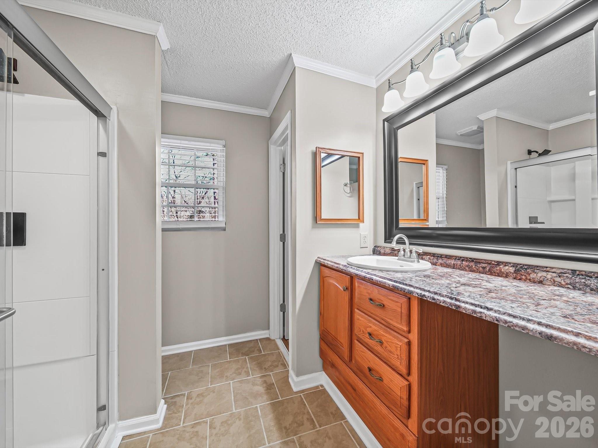 10351 Fink Road Mount Pleasant, NC 28124 - Photo 18 of 20 a bathroom with a granite countertop sink and a mirror