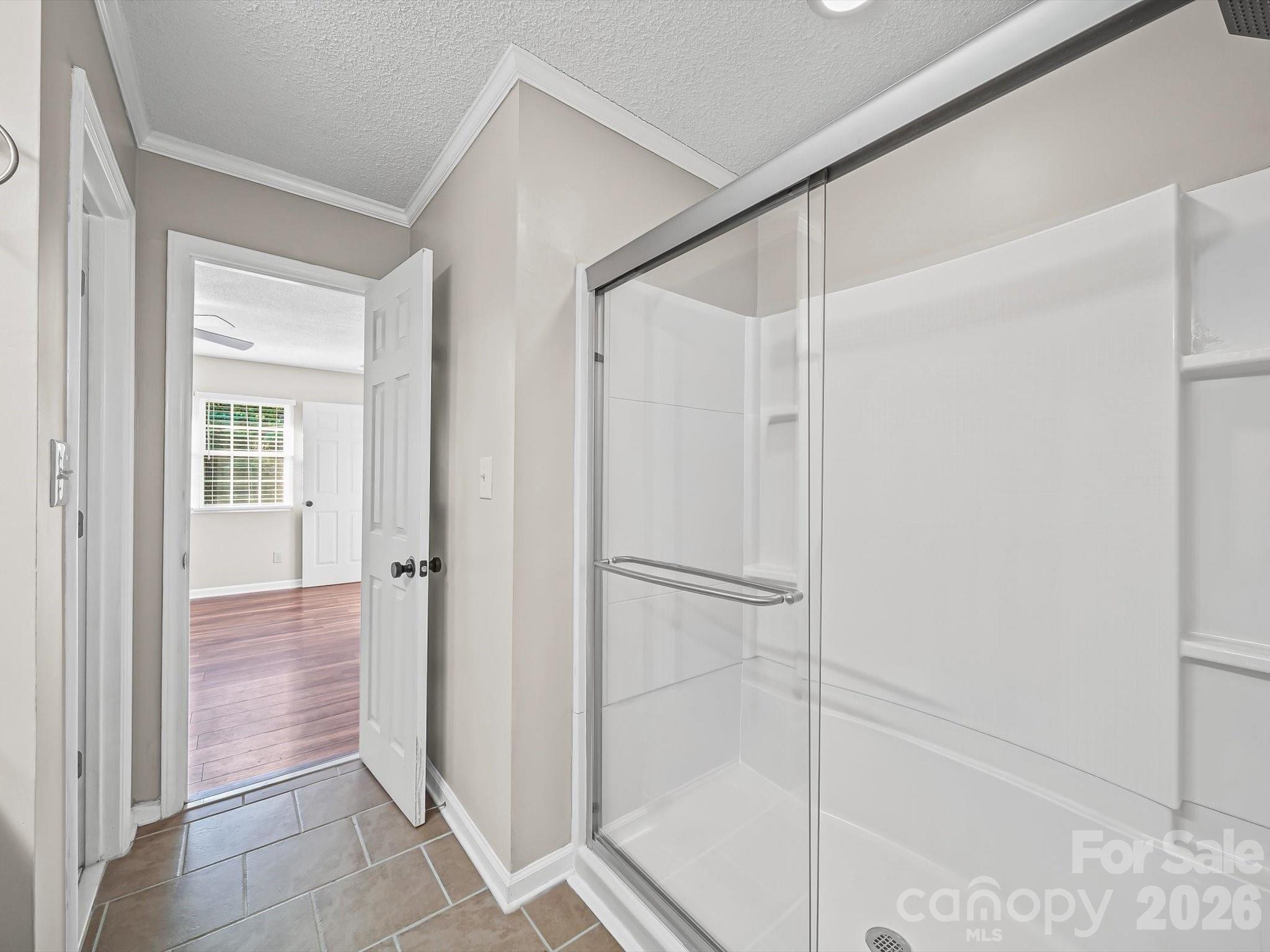 10351 Fink Road Mount Pleasant, NC 28124 - Photo 19 of 20 a bathroom with a shower and a glass door