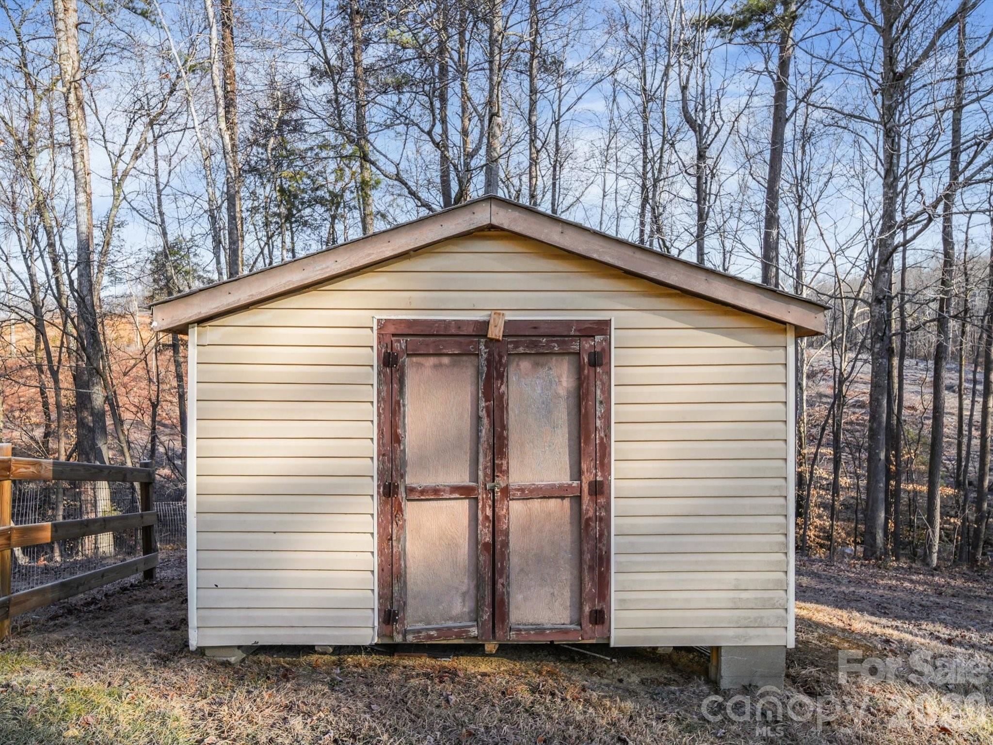10351 Fink Road Mount Pleasant, NC 28124 - Photo 20 of 20 a small white house with a white roof and next to a yard