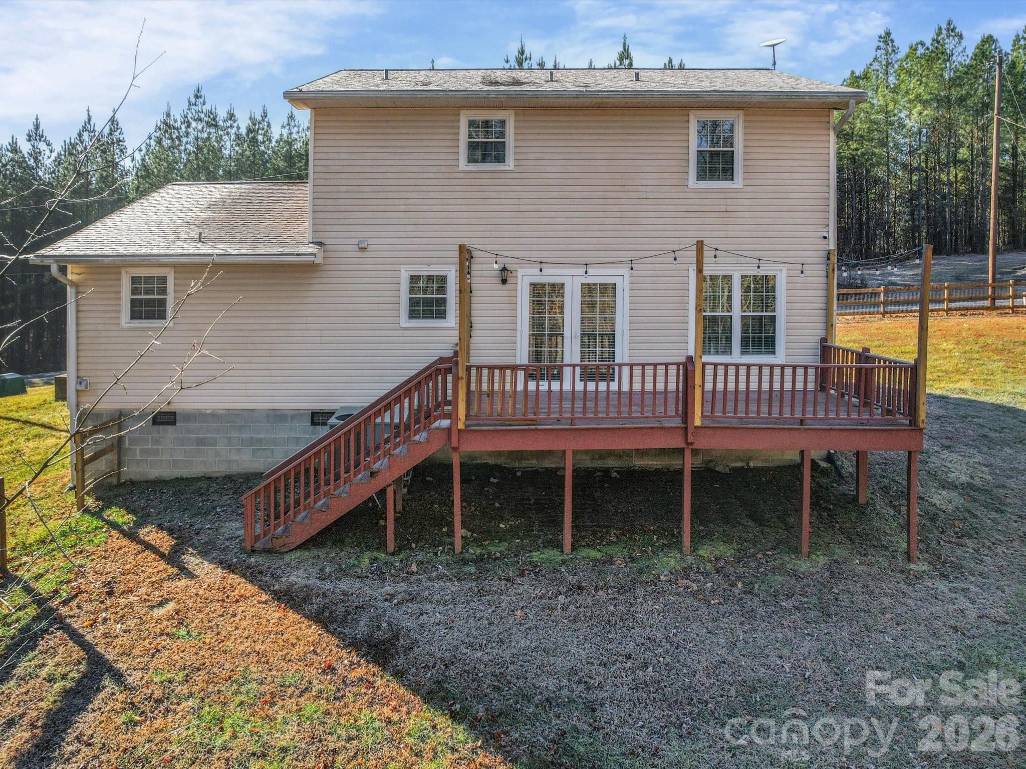 10351 Fink Road Mount Pleasant, NC 28124 - Photo 3 of 20 a view of a house with a bed and wooden deck