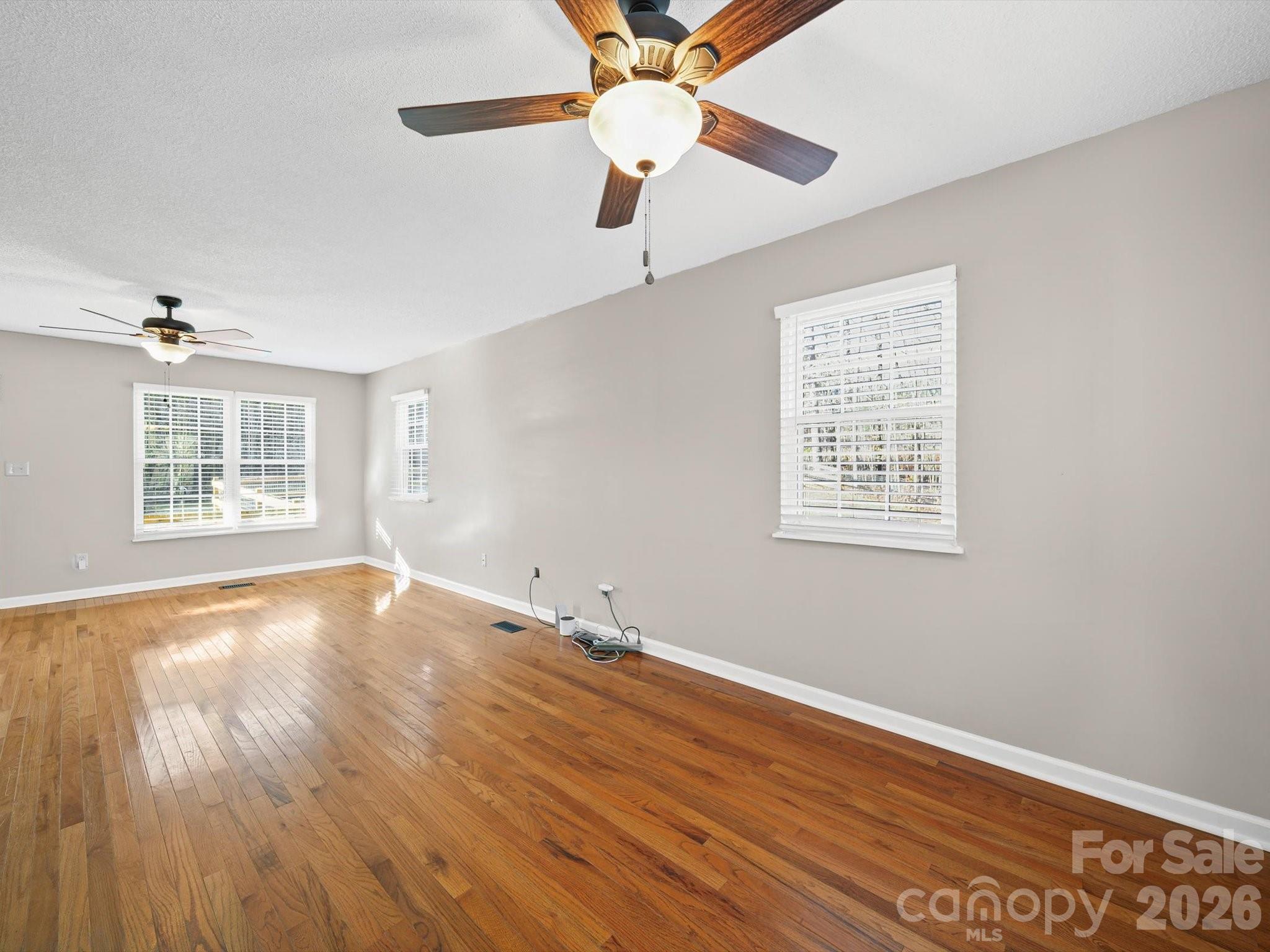 10351 Fink Road Mount Pleasant, NC 28124 - Photo 6 of 20 wooden floor in an empty room with a window