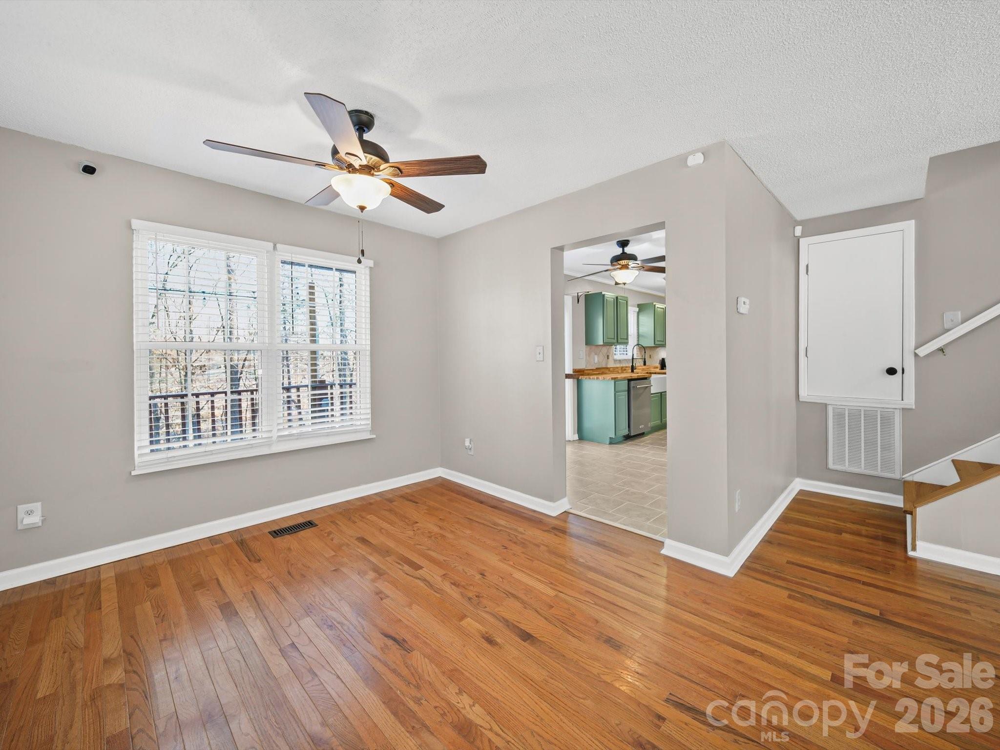 10351 Fink Road Mount Pleasant, NC 28124 - Photo 7 of 20 a view of an empty room with wooden floor and a window