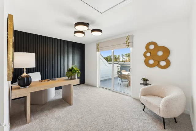 a bed room with a bed and a view of living room