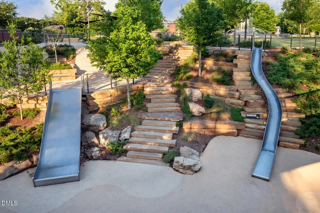 a swimming pool view with a seating space