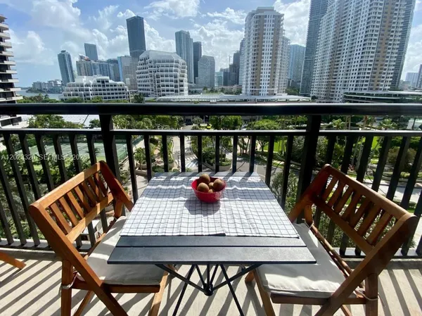 a view of a balcony with chairs