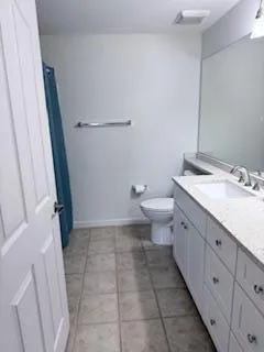 a view of a livingroom with wooden floor and window