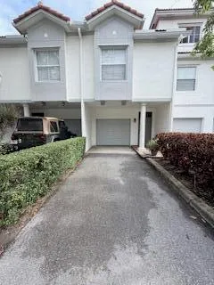 a view of a yard with a tree and table