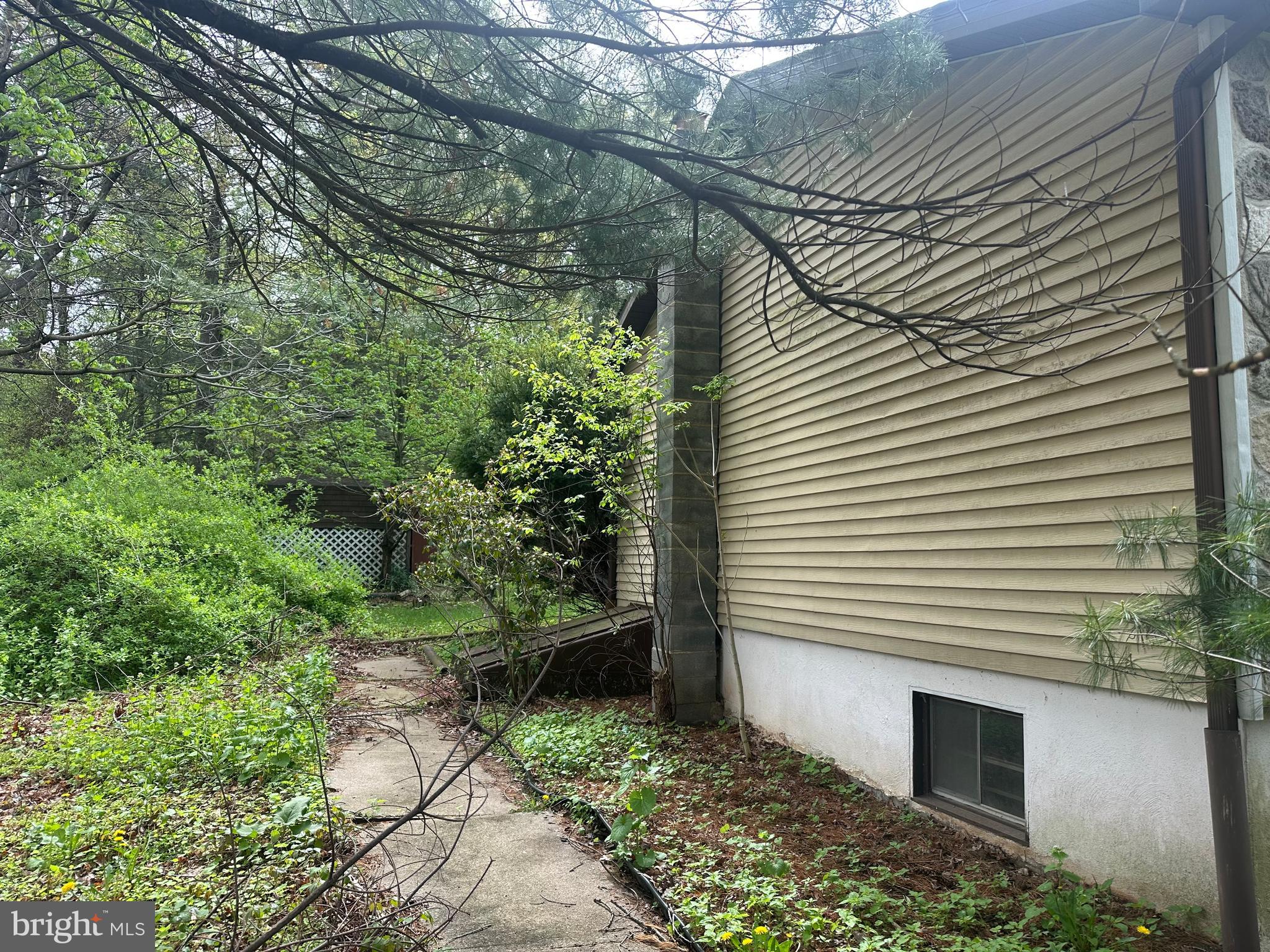 415 Forest Inn Road Lehighton, PA 18235 - Photo 22 of 25 Side yard with outside basement exit