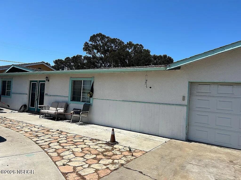 766 South 6th Street Grover Beach, CA 93433 - Photo 1 of 20 a backyard of a house with table and chairs
