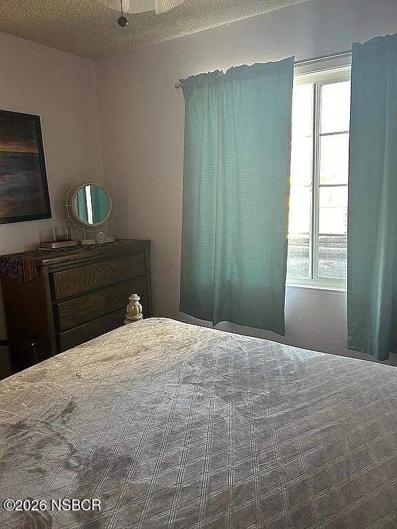 766 South 6th Street Grover Beach, CA 93433 - Photo 12 of 20 a bedroom with a bed and a window