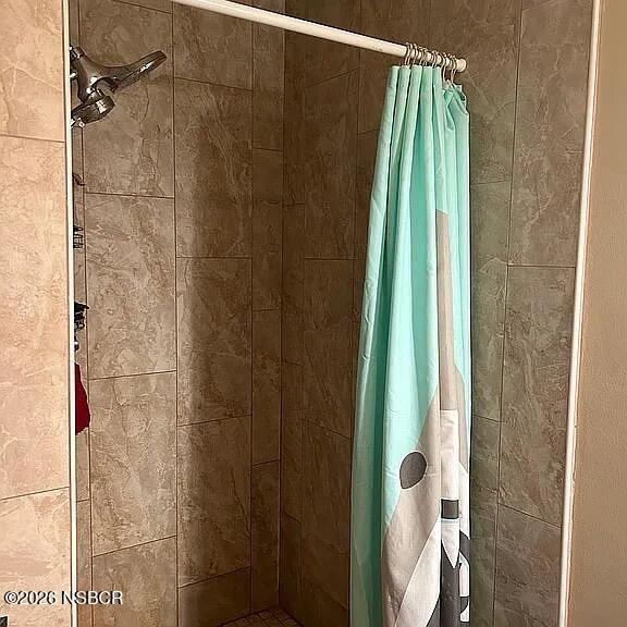 766 South 6th Street Grover Beach, CA 93433 - Photo 16 of 20 a bathroom with a shower and a tub