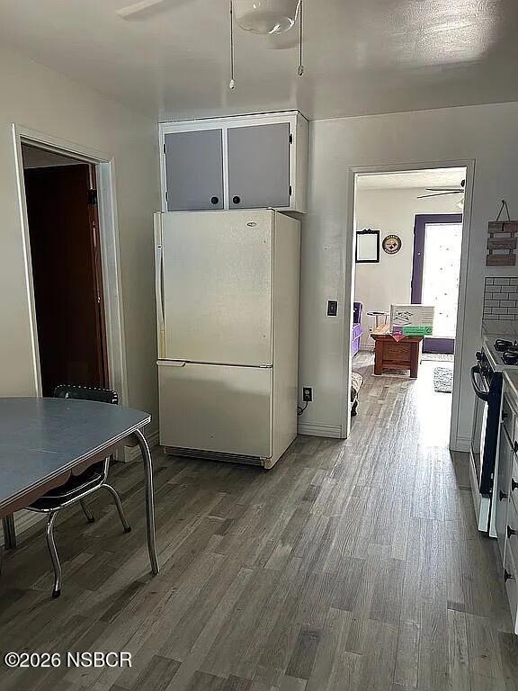 766 South 6th Street Grover Beach, CA 93433 - Photo 7 of 20 a view of kitchen with furniture and wooden floor