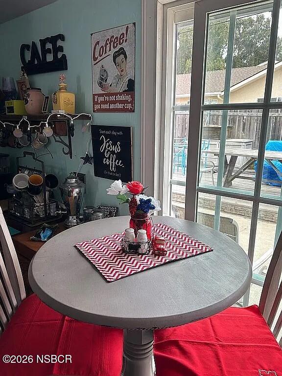 766 South 6th Street Grover Beach, CA 93433 - Photo 9 of 20 a view of a dining room with furniture wooden floor and a chandelier