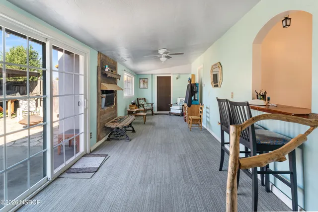 a view of a livingroom with furniture and hardwood floor