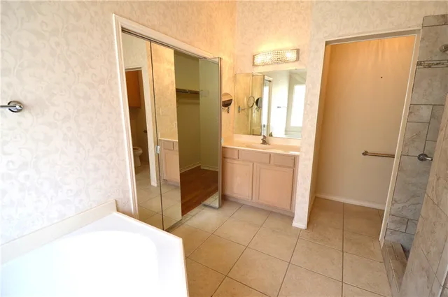 a white bath tub sitting in a bathroom