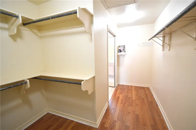 a view of an empty room with a large window