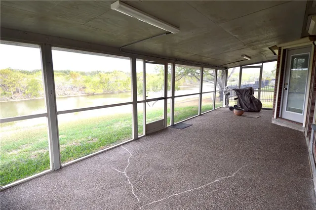 a view of a hallway with a porch