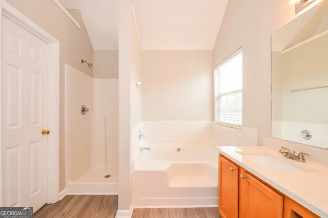 a bathroom with a sink and a bathtub