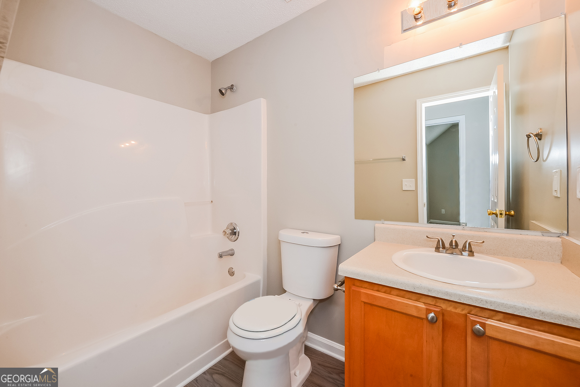 1707 Deer Crossing Way Jonesboro, GA 30236 - Photo 14 of 17 a bathroom with a sink toilet and shower
