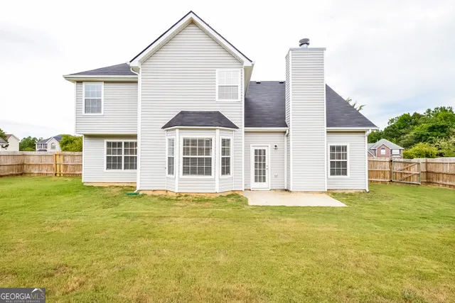 a big house with a big yard and more windows