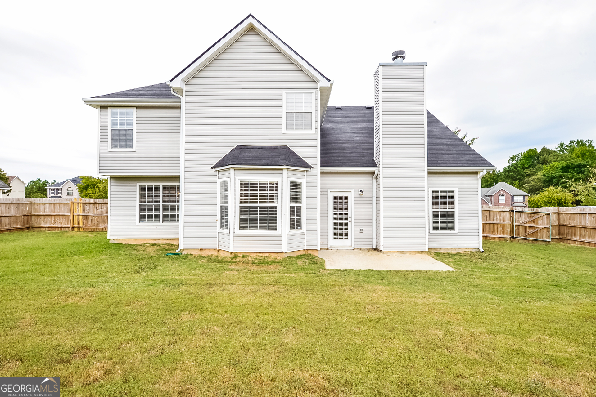 1707 Deer Crossing Way Jonesboro, GA 30236 - Photo 15 of 17 a big house with a big yard and more windows