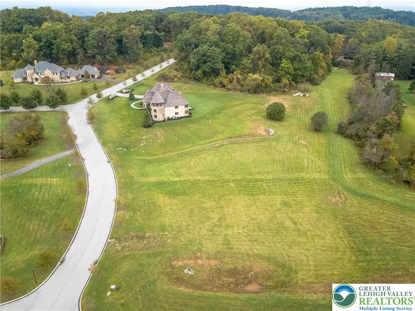 a view of a swimming pool with a yard