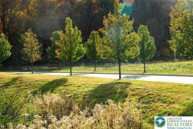 a view of a golf course with an outdoor space