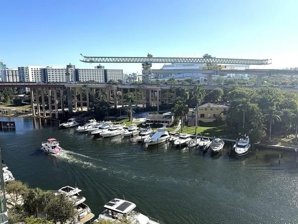 a view of a lake with boats and trees